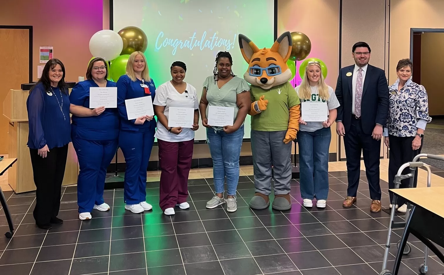 Pictured are Spring Semester scholarship recipients from the Coffee Campus of Wiregrass Georgia Technical College. Left to right: Wiregrass President DeAnnia Clements, Toni Roberts, Amber  Harper, Melissa Lynch, Jennifer Paulk, Max the Fox (Wiregrass mascot), Ellie Gosse, Director of Fundraising Will Bostelman, and Foundation Director Mona MacKenzie.