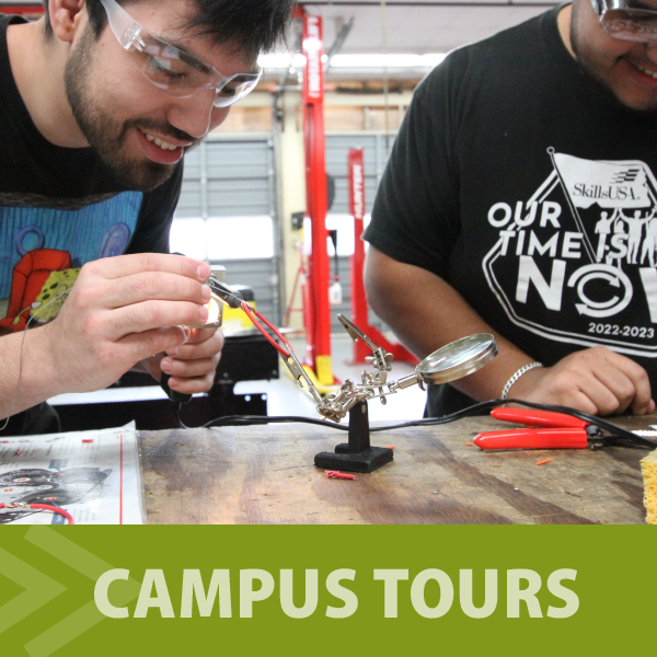 Visiting students wearing safety glasses in mechanics studio