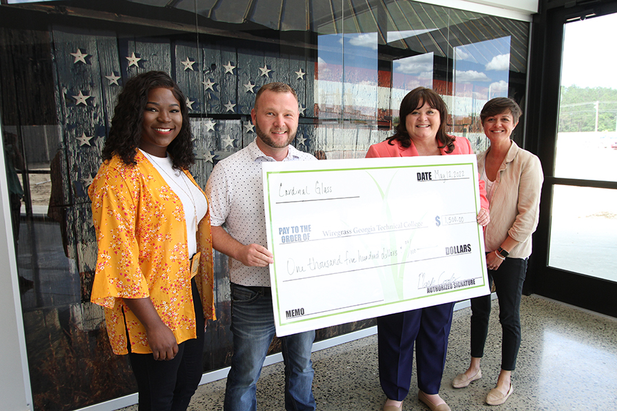 Cardinal Glass Industries donates $1,500 for apprenticeship scholarship. L-R Cardinal Glass Human Resources Manager Ashley Cook, Cardinal Glass Plant Manager Mark Comb, Wiregrass President DeAnnia Clements, and Wiregrass Executive Director of Department Affairs Nicole West.