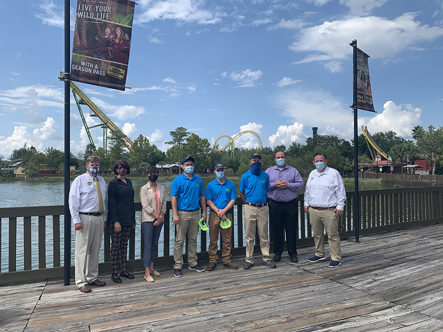 Wiregrass faculty standing with Wild Adventures faculty 