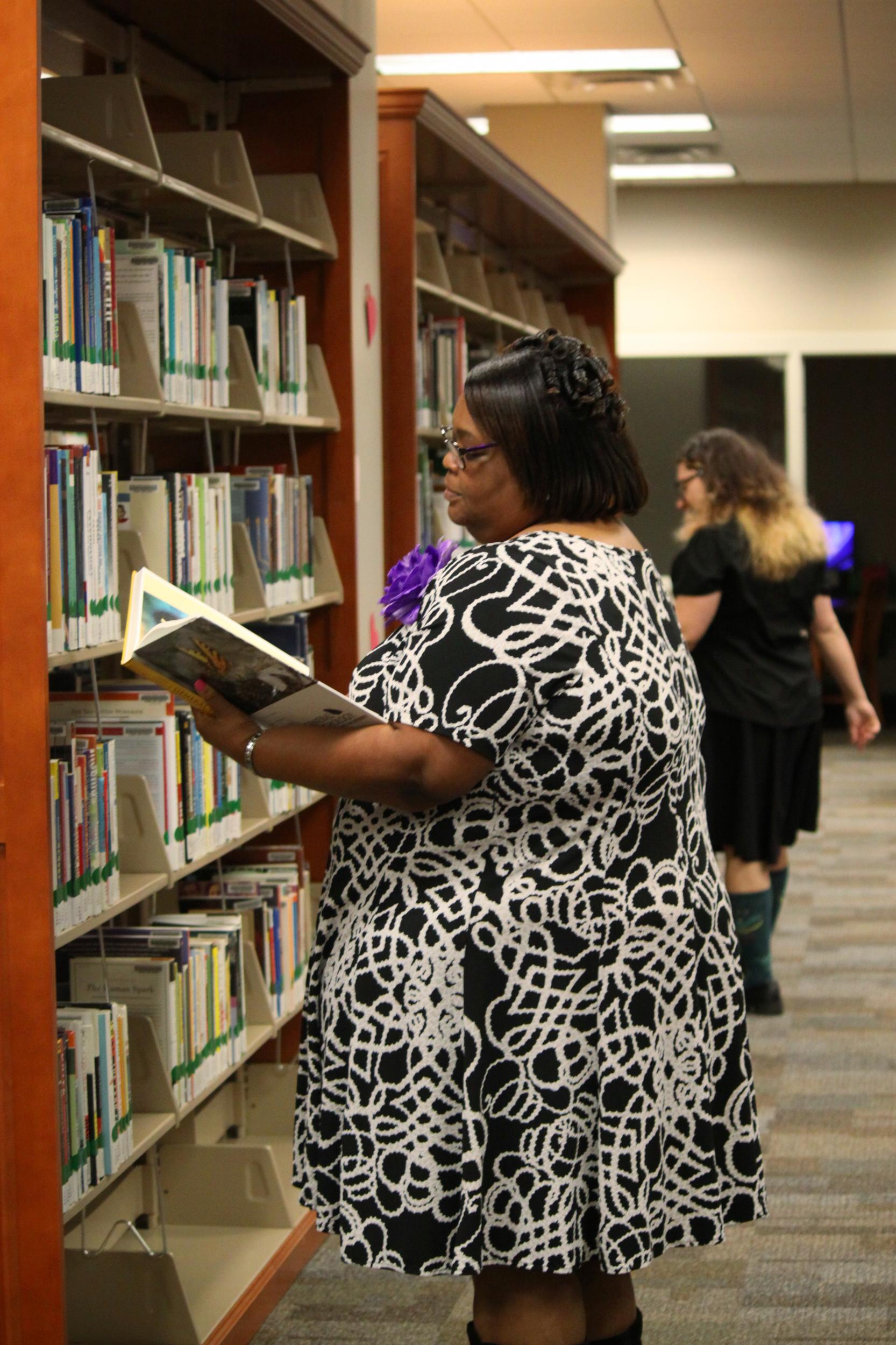 Students in Library reading a book