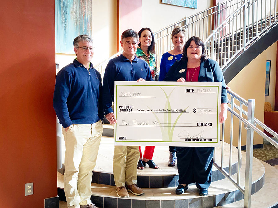 Satilla REMC Foundation Chair Jim Tucker, Romeo Reyes CEO of Satilla REMC, WGTC President DeAnnia Clements. Back Row L-R; WGTC Executive Director of Fundraising Crissy Staley and WGTC Ben Hill-Irwin Campus Administrator Mona Paulk