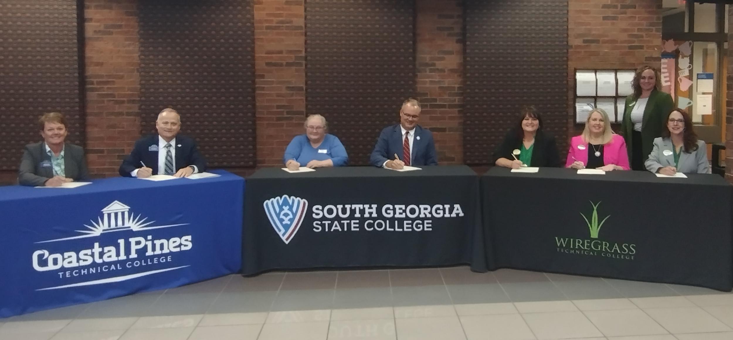 PHOTO: L-R: Amanda Morris, Executive Vice President and Vice President for Academic Affairs, and Lonnie Roberts, President (Coastal Pines Technical College); Sara Selby, Interim Vice President for Academic and Student Affairs, and Dr. Greg Tanner, Interim President (South Georgia State College); DeAnnia Clements, President, April McDuffie, Executive Vice President for Academic Affairs, and Dr. Shannon McConico, Vice President for Enrollment Management (Wiregrass Technical College) and standing Dr. Jammie Wilbanks (Senior Institutional Research and Planning Analyst).