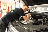 Automotive student works on a vehicle